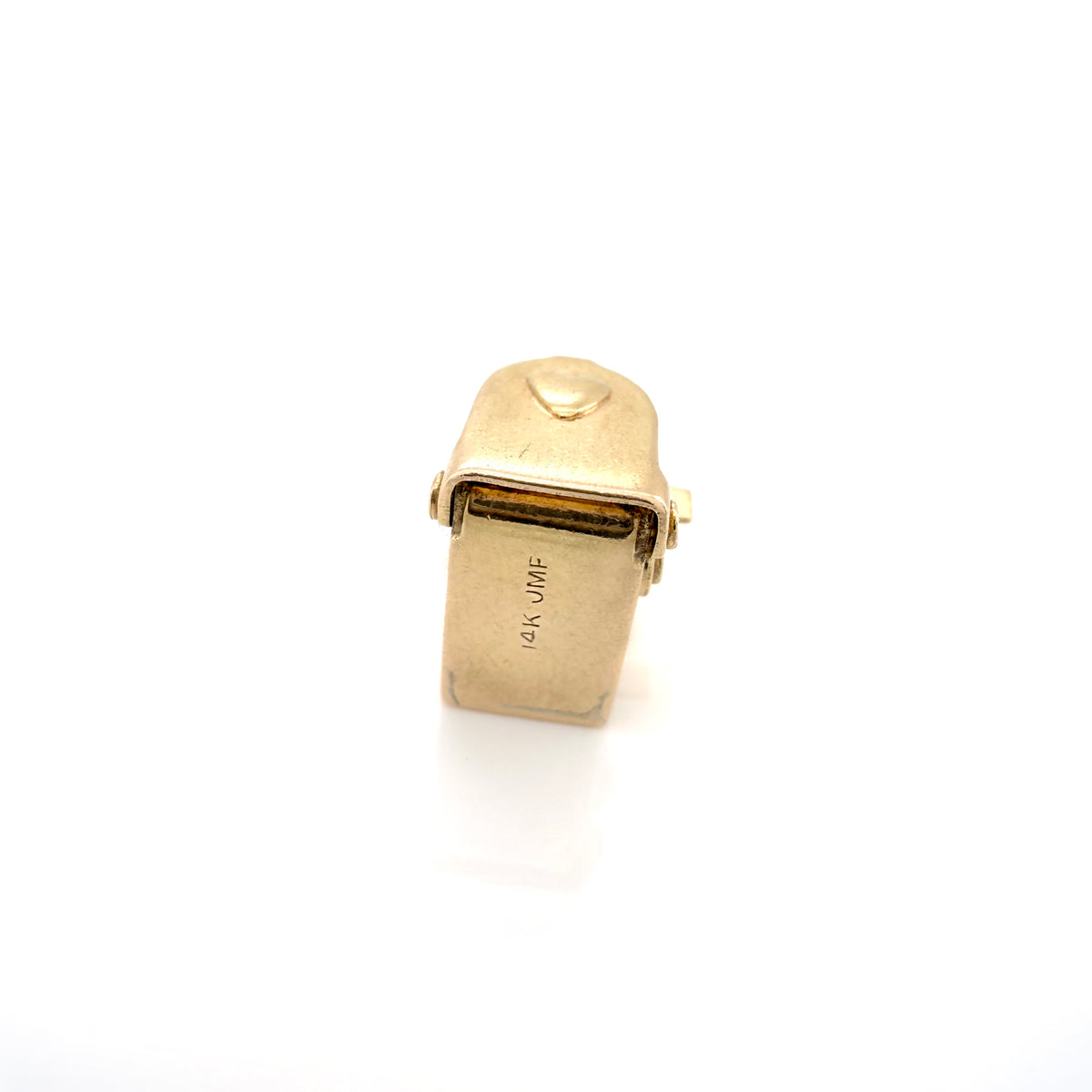 A vintage gold charm, showing '14K JMF' stamped on the side, set against a plain white background.