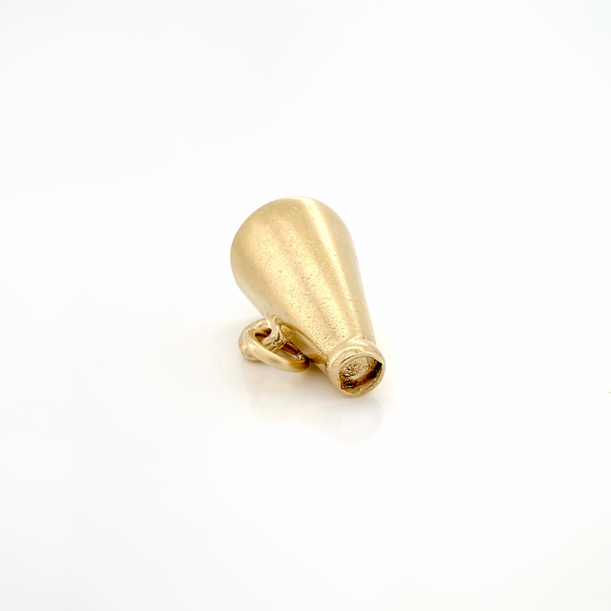 A gold megaphone charm with a and a small loop at the base, shown on a plain white background.