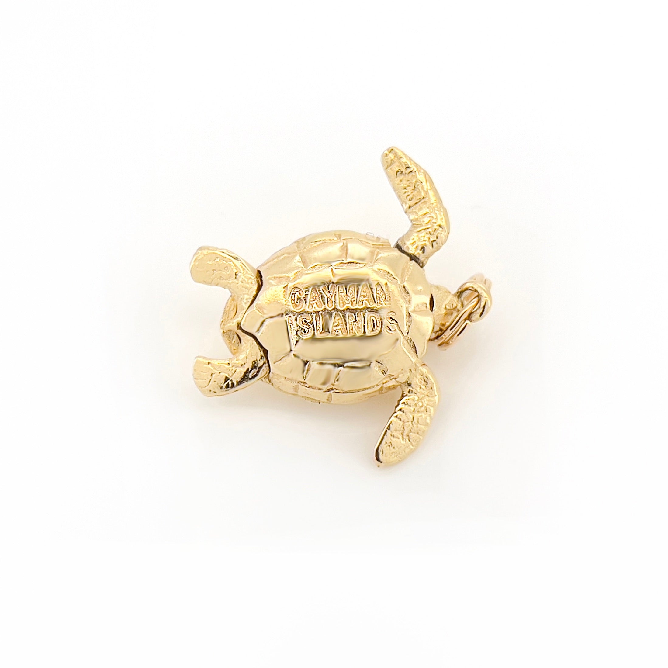 Gold turtle pendant with 'Cayman Islands' text on a white background