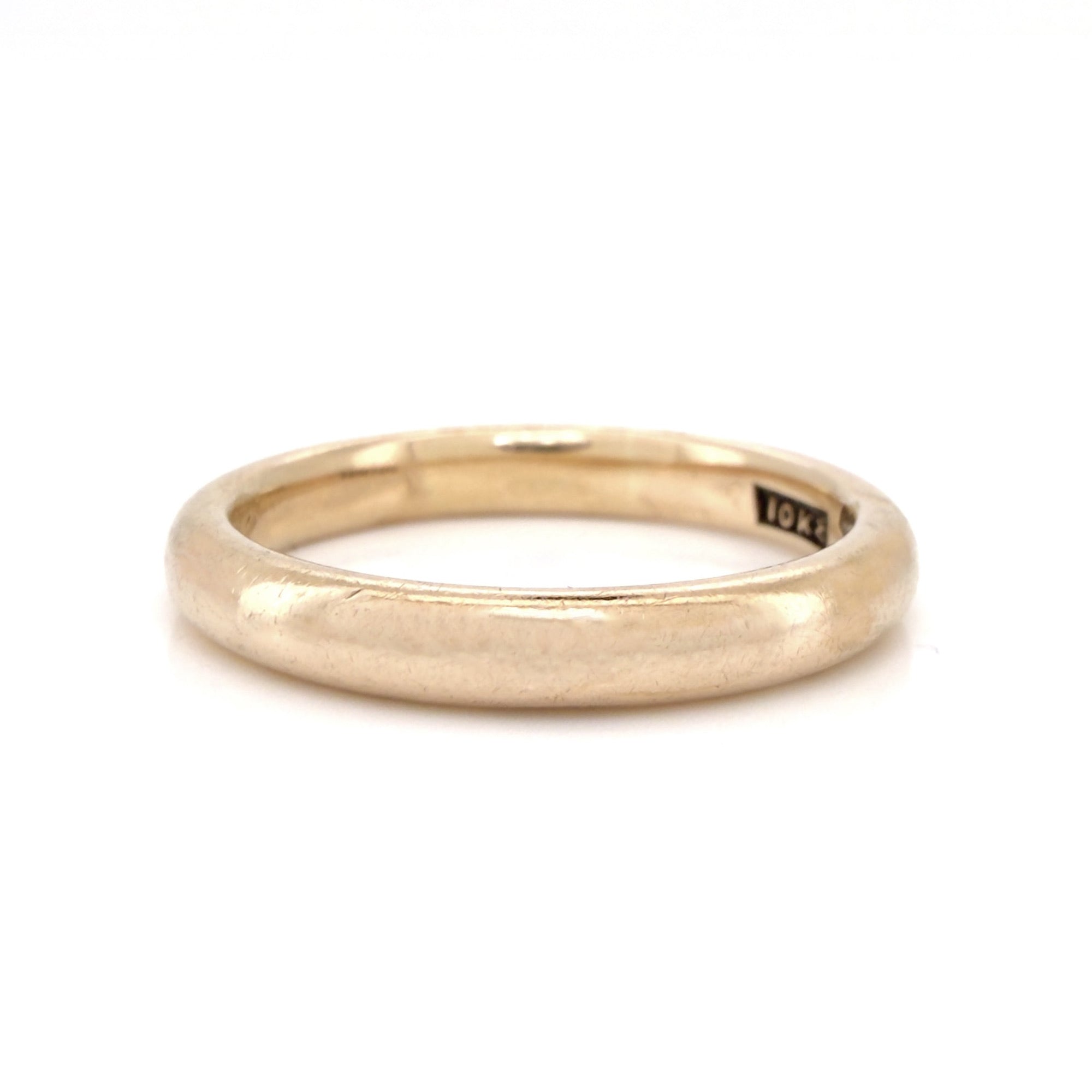 Antique gold ring on a white background