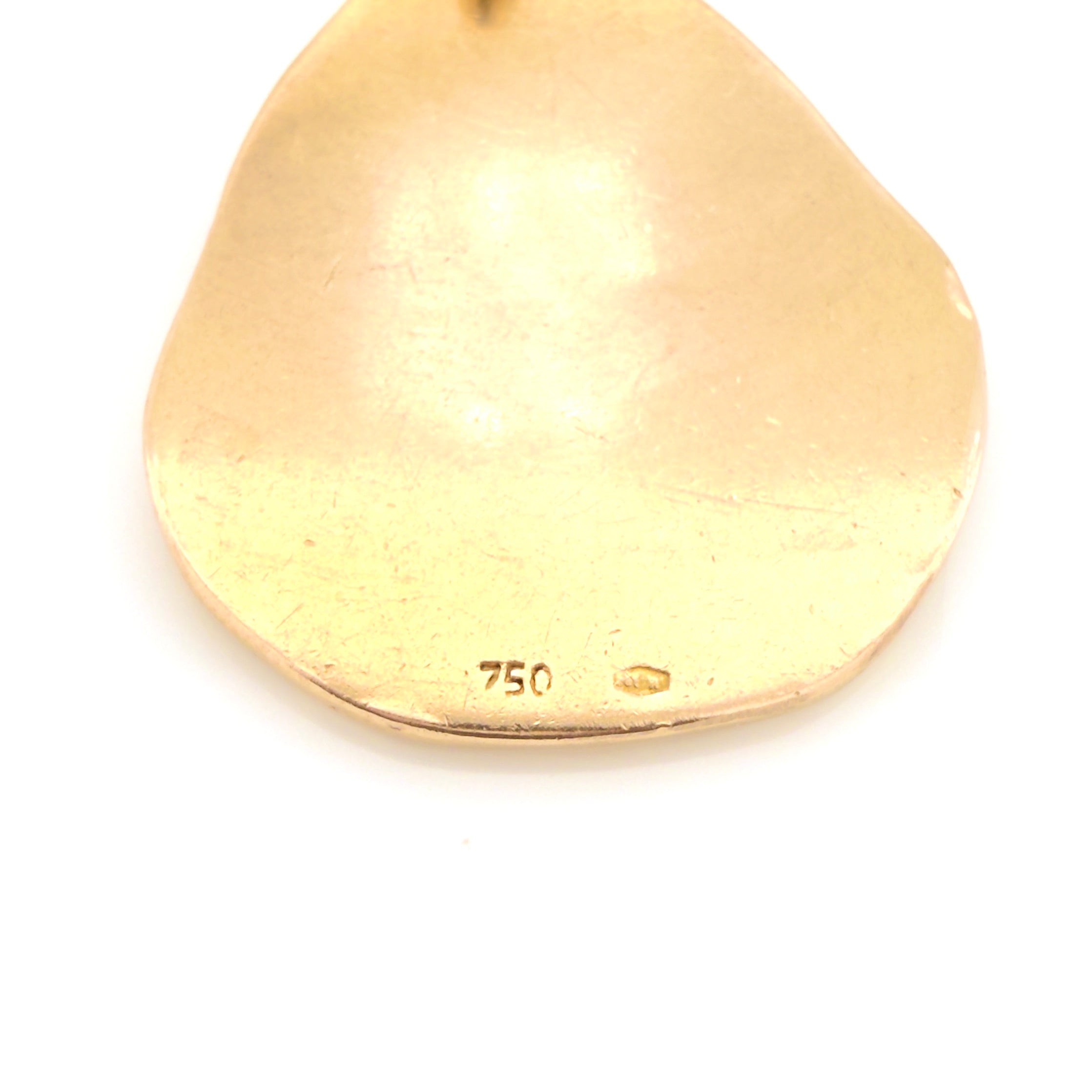 Gold pendant with '750' stamp and Italian hallmarks on a white background