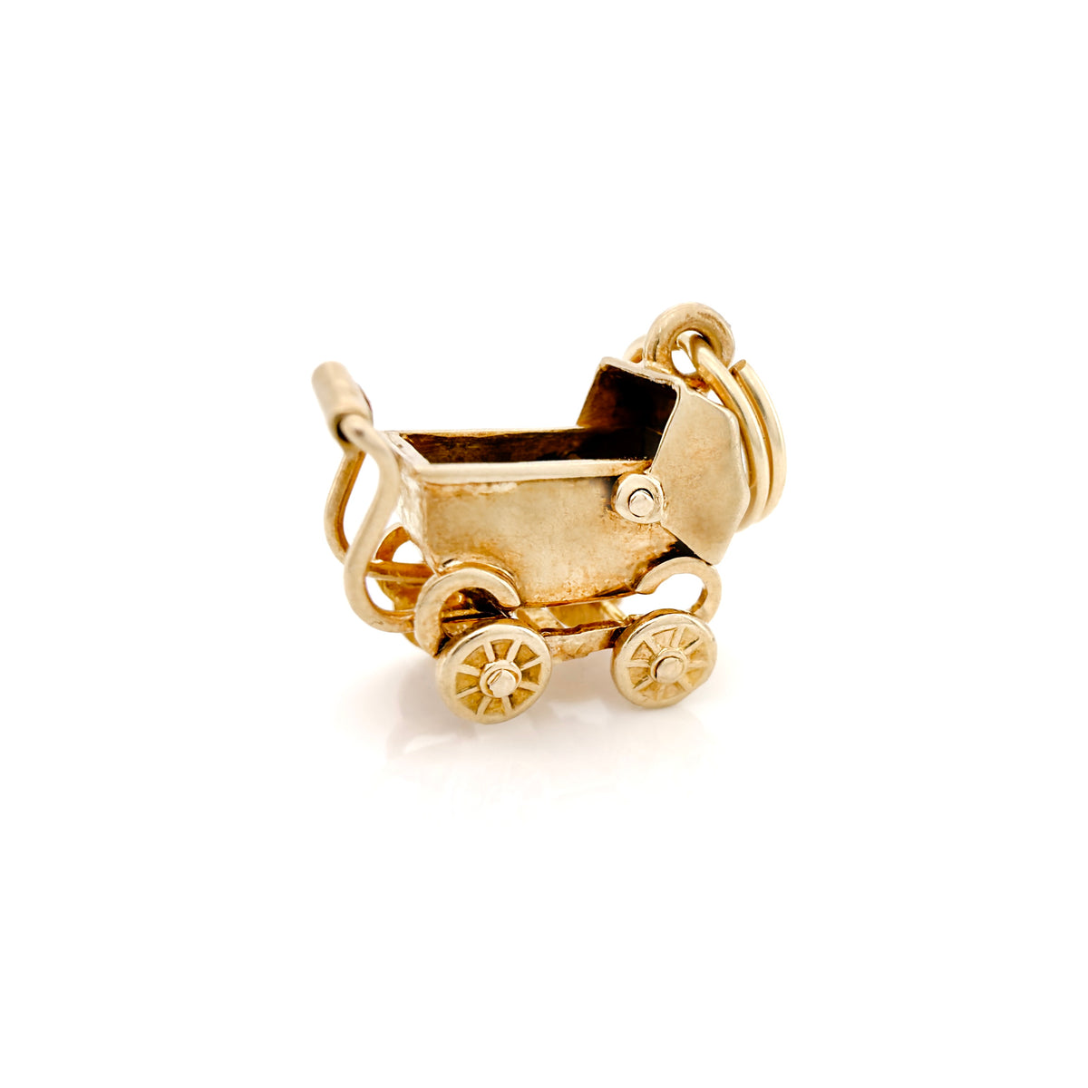 A small gold charm shaped like a baby stroller, photographed on a clean white background.