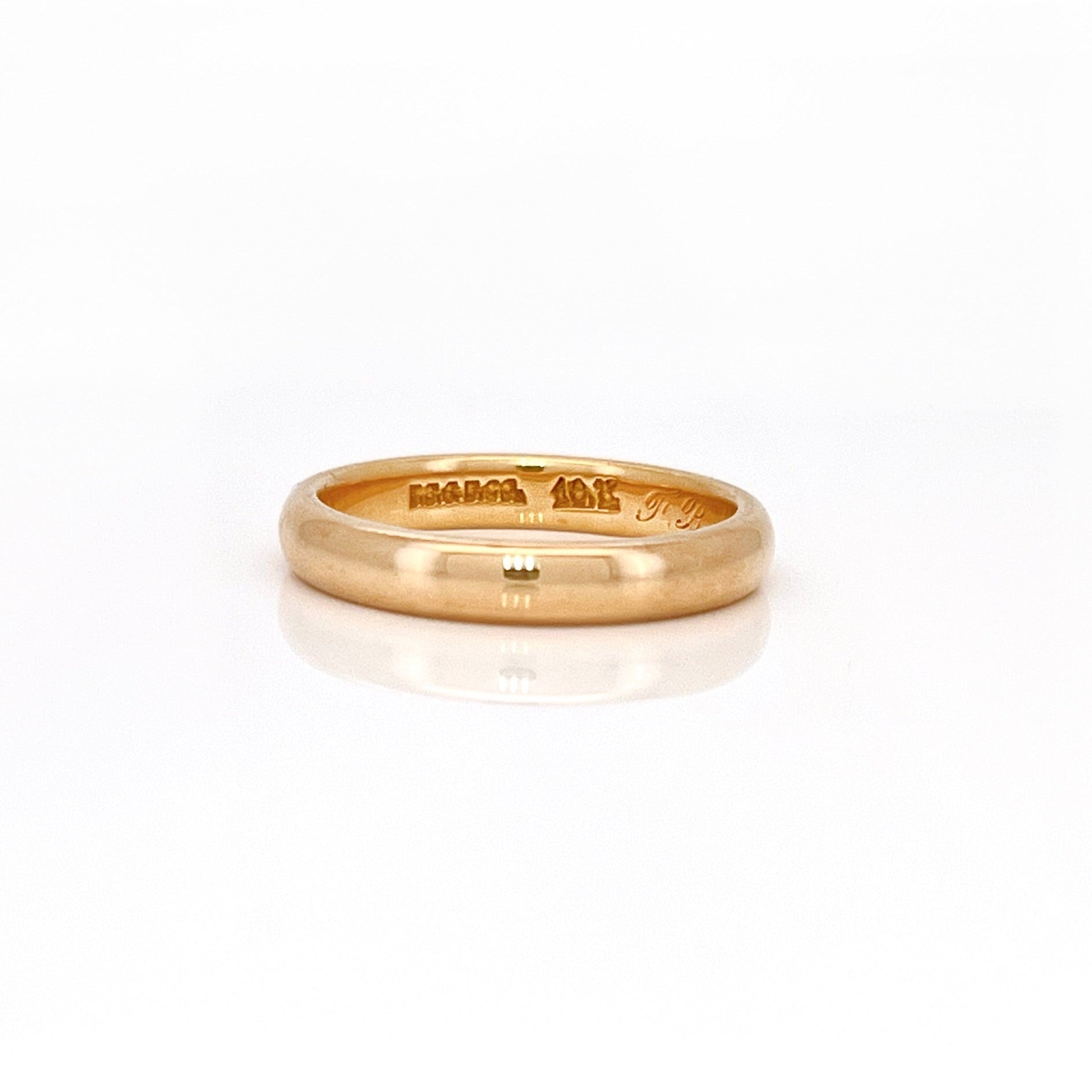 Gold ring on a white background