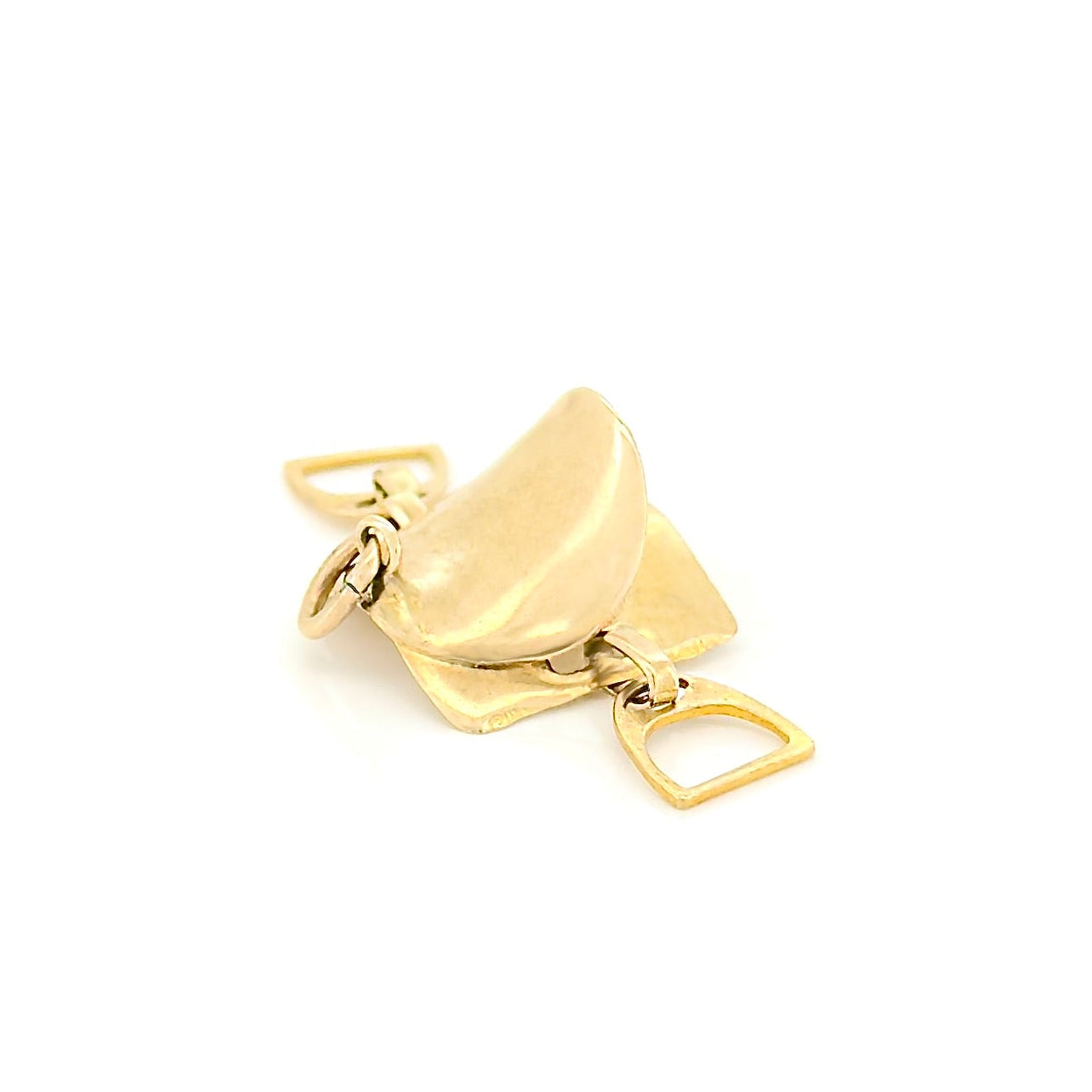 Gold saddle charm on a white background