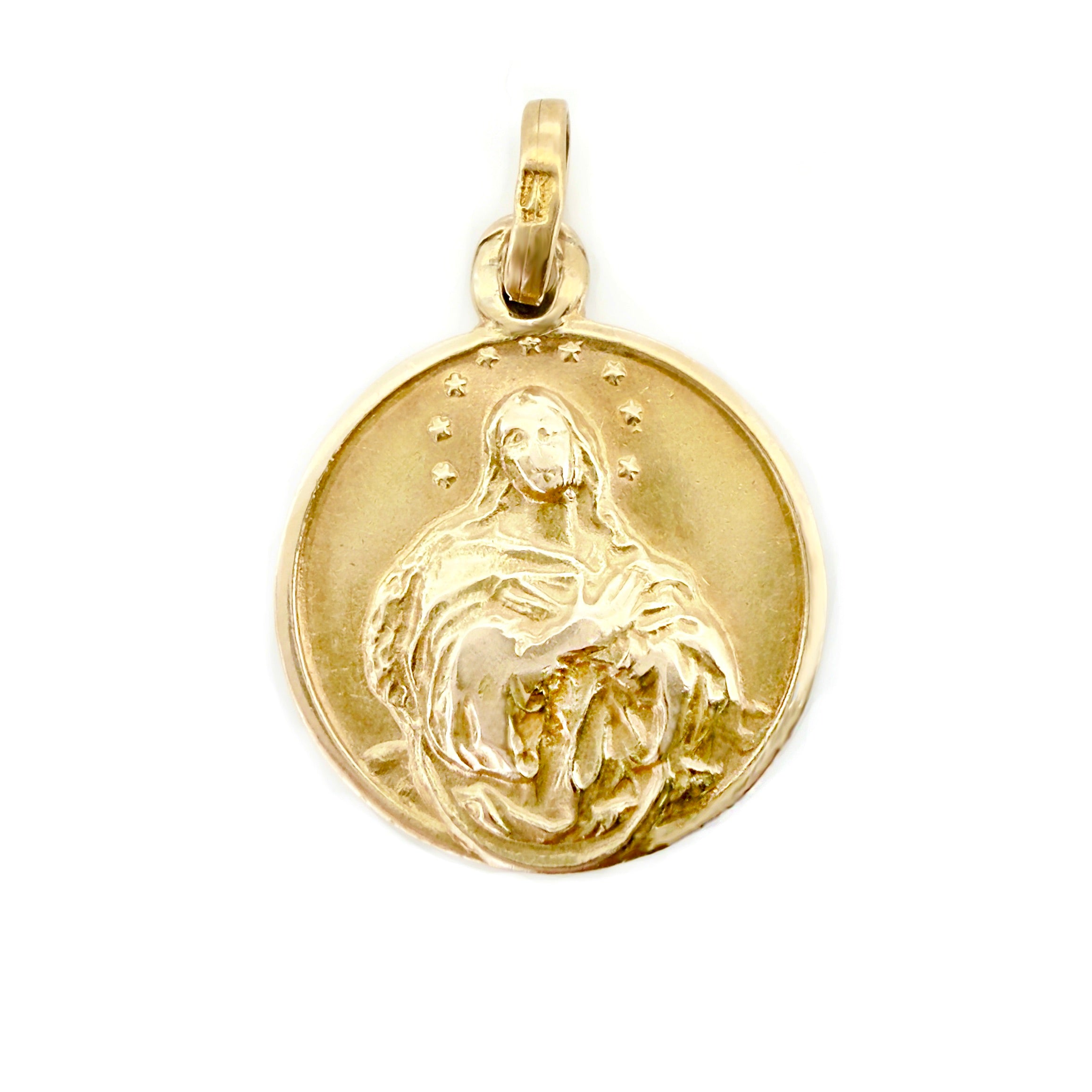Gold pendant with a religious figure on a white background