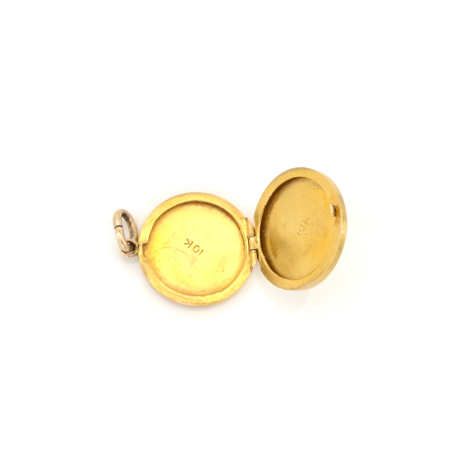 Gold locket  with a 10K stamp on a white background