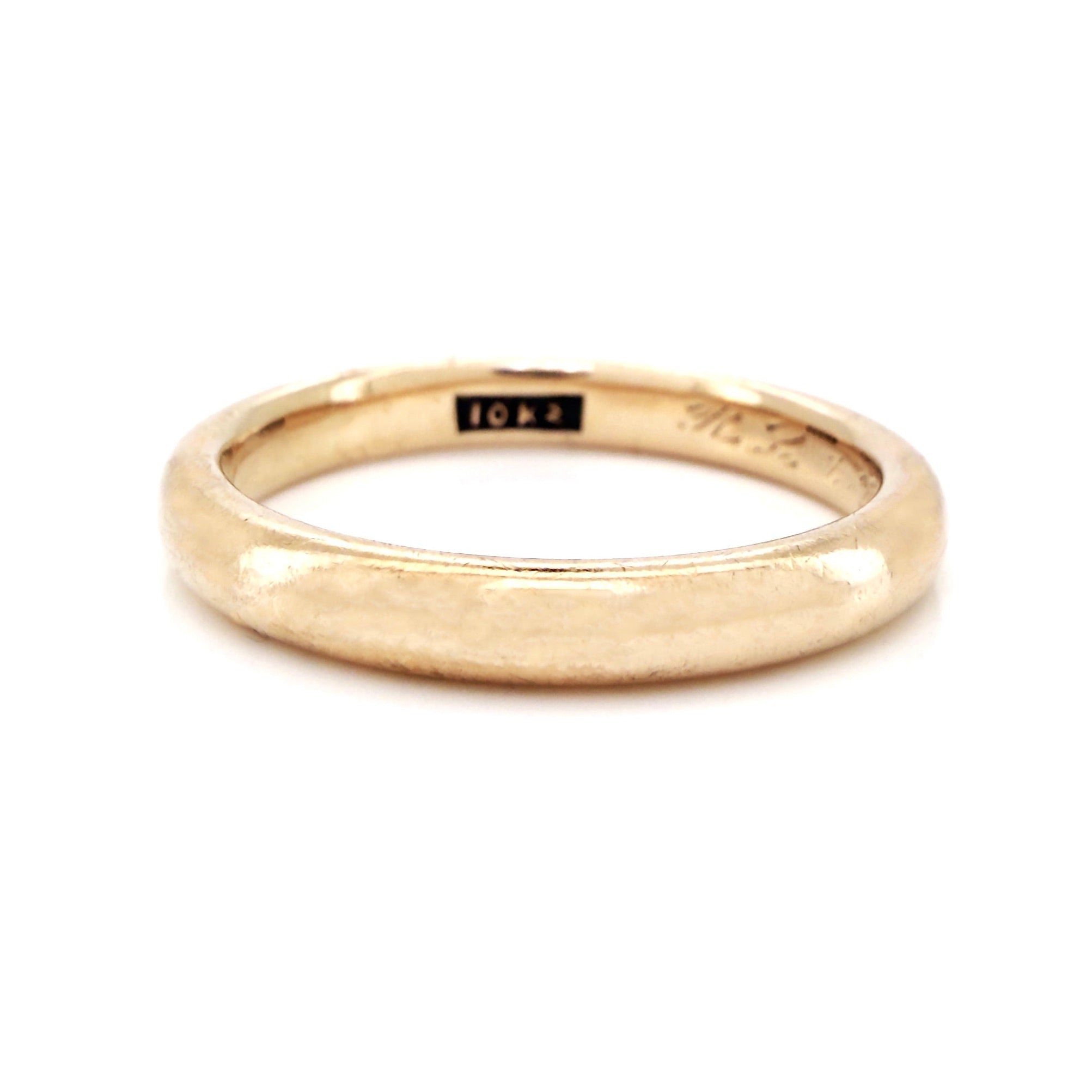 Antique gold ring on a white background