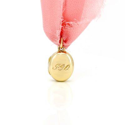 Yellow gold oval locket.